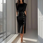 Woman wearing a black side button midi split hem dress - lifestyle photo