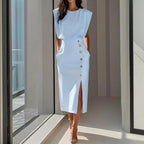 Woman wearing a light blue side button midi split hem dress - lifestyle photo