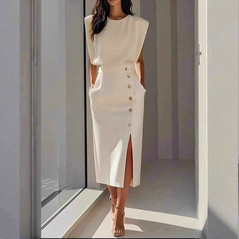 Woman wearing a white side button midi split hem dress - lifestyle photo