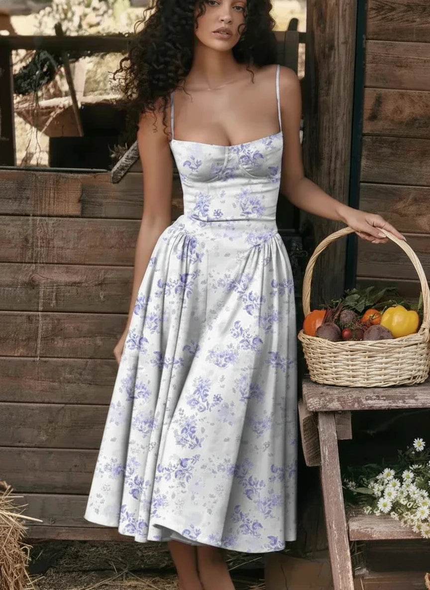Woman wearing a light blue sleeveless corset style midi dress - studio photo