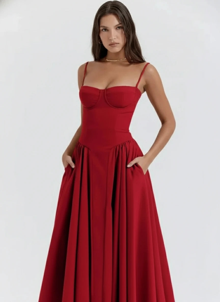 Woman wearing a red sleeveless corset style midi dress - studio photo