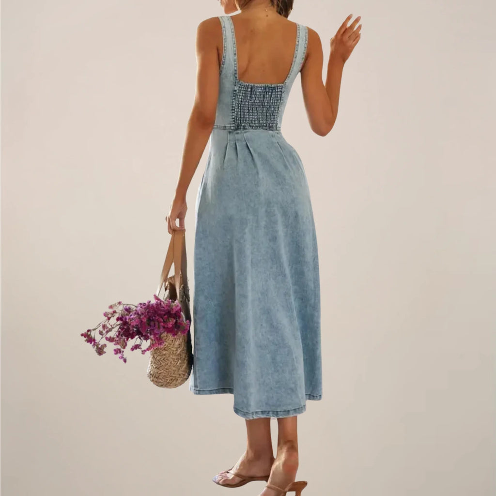 Woman wearing a light blue sleeveless denim midi dress - outdoor lifestyle photo