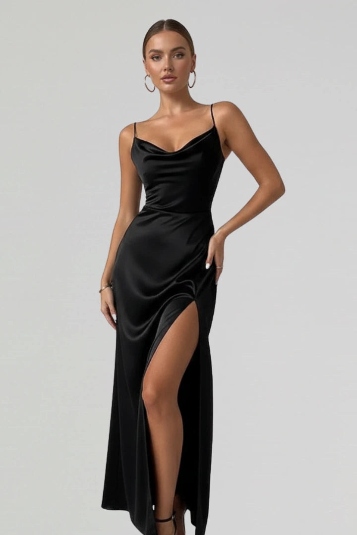 Woman wearing a black slim strap draped dress - studio photo