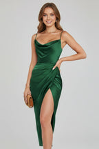 Woman wearing a green slim strap draped dress - studio photo