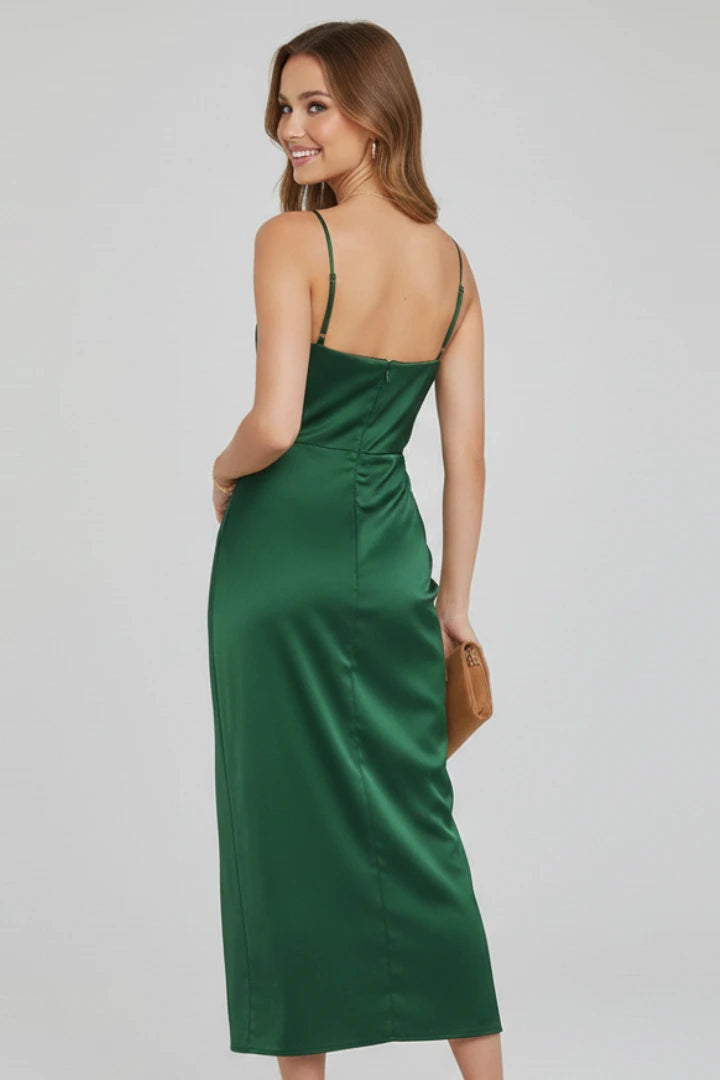 Woman wearing a green slim strap draped dress - studio photo