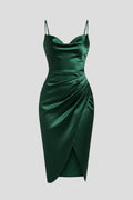 Woman wearing a green slim strap draped dress - studio photo