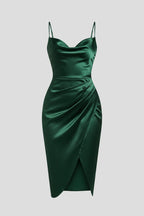 Woman wearing a green slim strap draped dress - studio photo