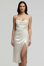 Woman wearing a white slim strap draped dress - studio photo