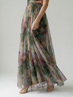 Woman wearing a dark green soft wrap maxi dress - studio photo
