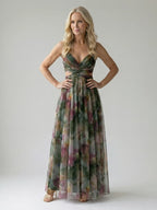 Woman wearing a dark green soft wrap maxi dress - studio photo