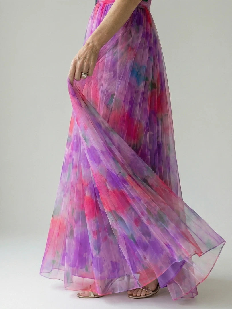 Woman wearing a purple soft wrap maxi dress - editorial style photo