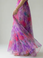 Woman wearing a purple soft wrap maxi dress - editorial style photo