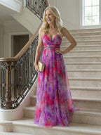 Woman wearing a purple soft wrap maxi dress - studio photo