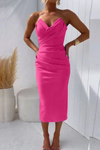 Woman wearing a rose solid cocktail midi dress - studio photo