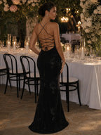 Woman wearing a black spaghetti strap corset maxi dress - editorial style photo
