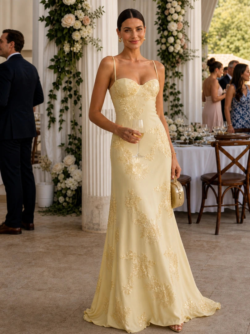 Woman wearing a yellow spaghetti strap corset maxi dress - editorial style photo