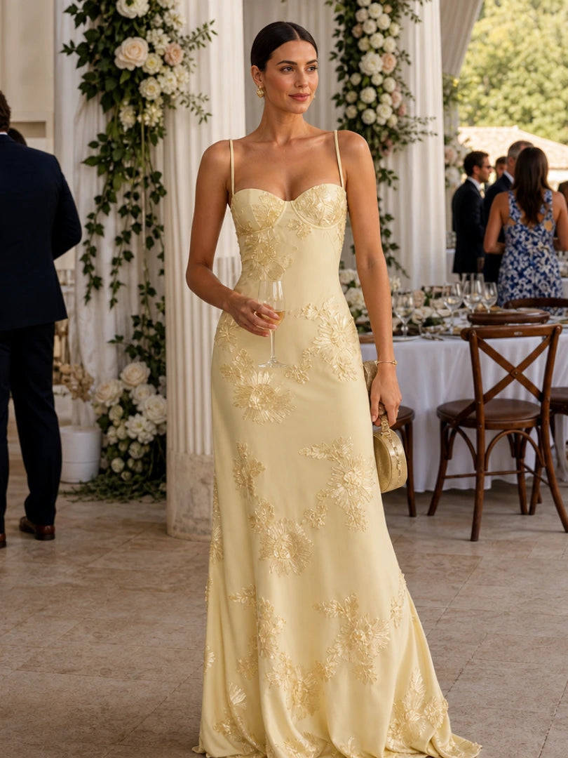 Woman wearing a yellow spaghetti strap corset maxi dress - editorial style photo