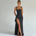 Woman wearing a grey square neck high slit maxi dress - studio photo