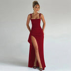 Woman wearing a red square neck high slit maxi dress - studio photo