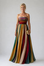 Woman wearing a multi color strapless a-line lightweight dress - editorial style photo
