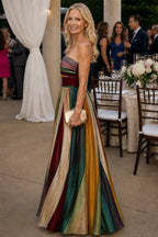 Woman wearing a multi color strapless a-line lightweight dress - editorial style photo