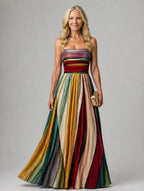 Woman wearing a multi color strapless a-line lightweight dress - editorial style photo