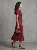 Woman wearing a red stripe pleated midi dress - lifestyle photo