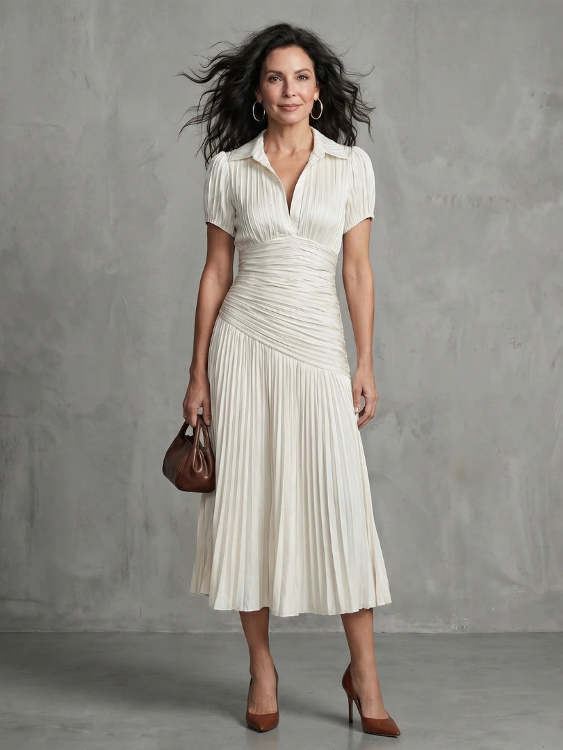 Woman wearing a white stripe pleated midi dress - lifestyle photo