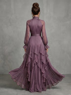 Woman wearing a purple tie neck ruffle tiered maxi dress - editorial style photo
