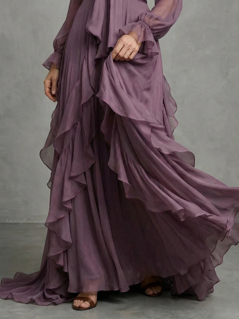 Woman wearing a purple tie neck ruffle tiered maxi dress - editorial style photo