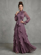Woman wearing a purple tie neck ruffle tiered maxi dress - studio photo
