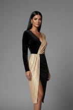 Woman wearing a black v-neck long sleeve dress - studio photo