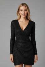 Woman wearing a black v-neck long sleeve dress - studio photo
