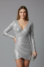 Woman wearing a silver v-neck long sleeve dress - studio photo