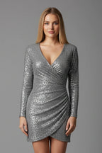 Woman wearing a silver v-neck long sleeve dress - studio photo