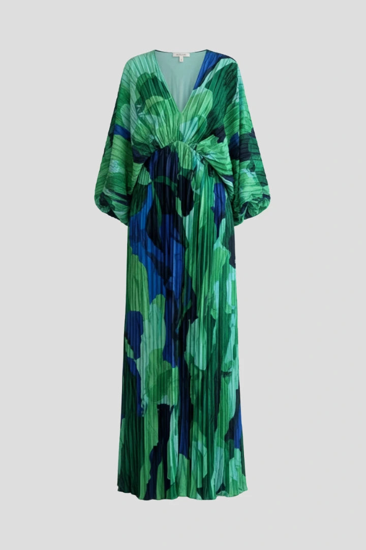 Woman wearing a green v-neck pleated maxi dress - studio photo