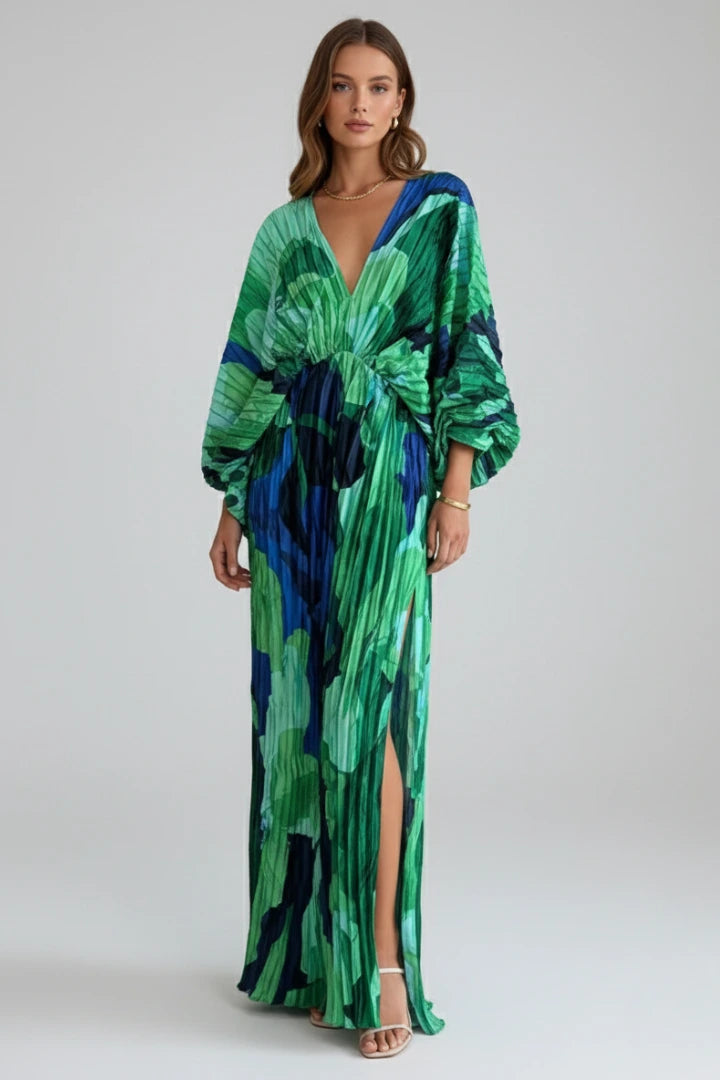 Woman wearing a green v-neck pleated maxi dress - studio photo