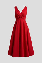 Woman wearing a red v-neck zip closure midi dress - studio photo