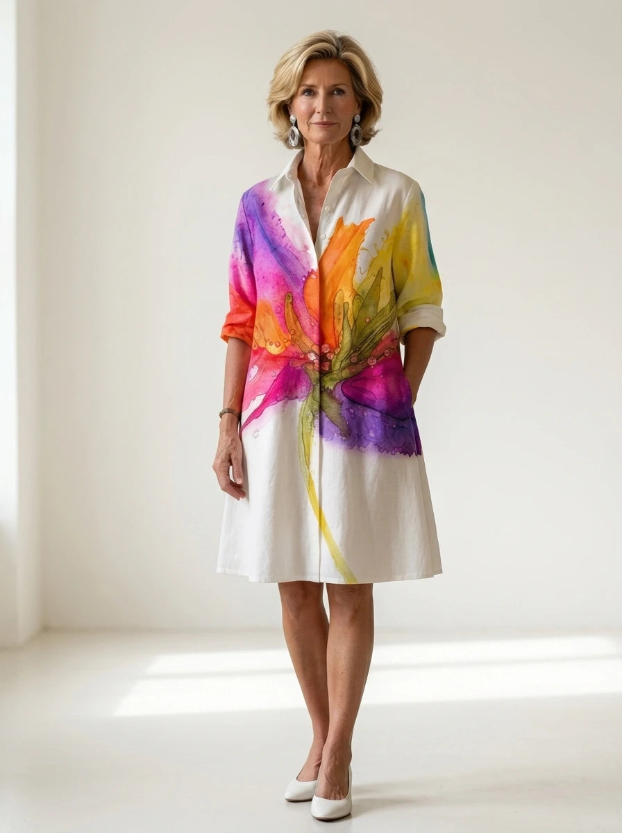 Driftly multicolor floral print collared midi dress with partial button front and rolled cuffs, in a minimalist studio setting with soft window light.