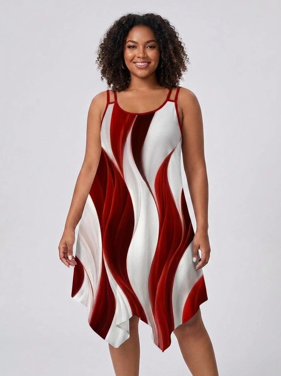 Plus size woman wearing a red and white geometric print asymmetrical dress in a studio setting