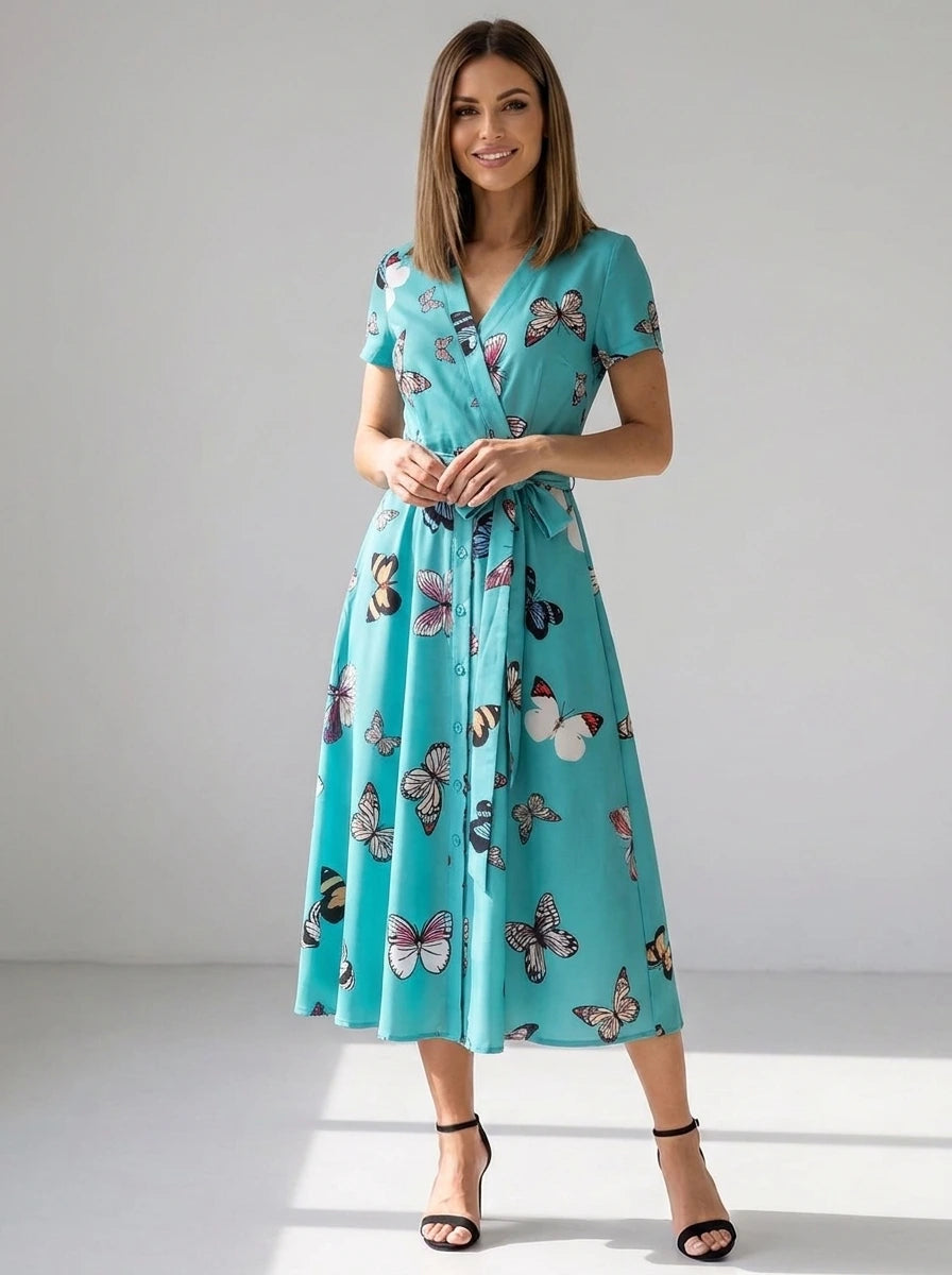Driftly women's turquoise blue butterfly print V-neck A-line maxi dress, in a minimalist studio setting.