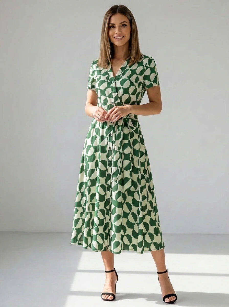Driftly women's green geometric print V-neck A-line maxi dress, in a minimalist studio setting.