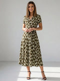 Driftly women's khaki geometric print V-neck A-line maxi dress, in a minimalist studio setting.