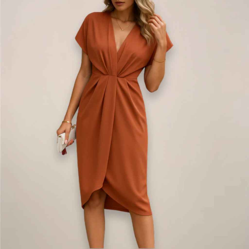 Woman wearing a rust wrap midi dress - studio photo