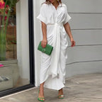 Woman wearing a white wrap short sleeve midi dress - outdoor lifestyle photo