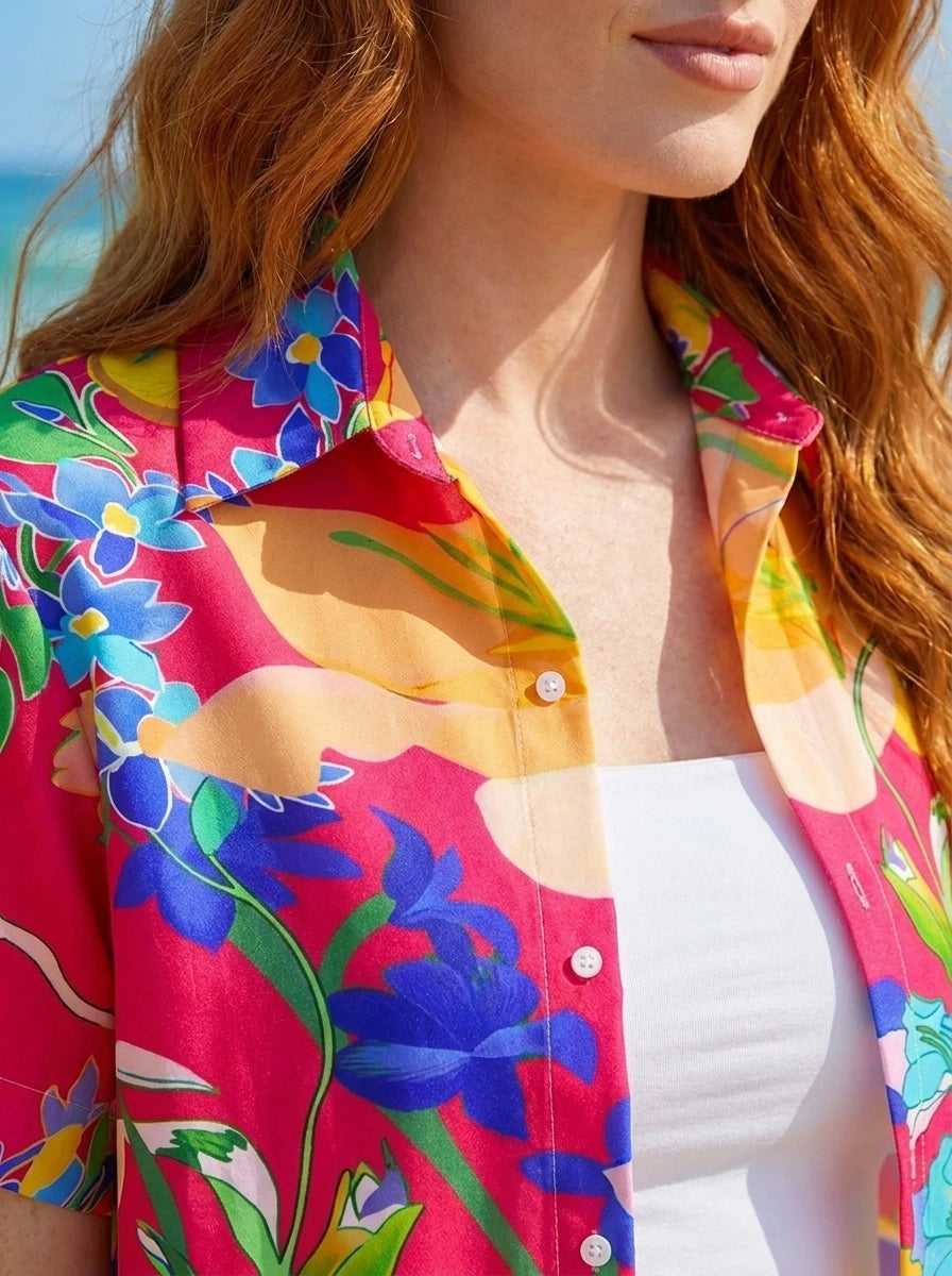 Close-up detail of red tropical floral button-up shirt collar and buttons