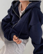 Driftly zip-up hoodie in navy black, worn by model
