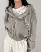 Driftly zip-up hoodie in grey, worn by model