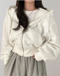 Driftly zip-up hoodie in white, worn by model