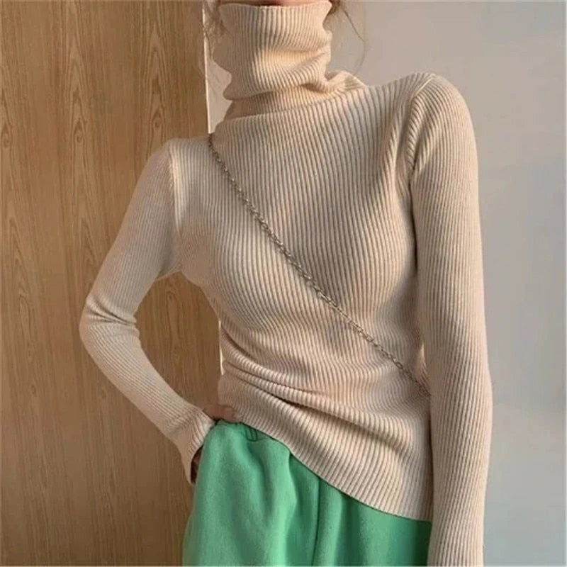 Woman wearing beige ribbed turtleneck slim fit jumper